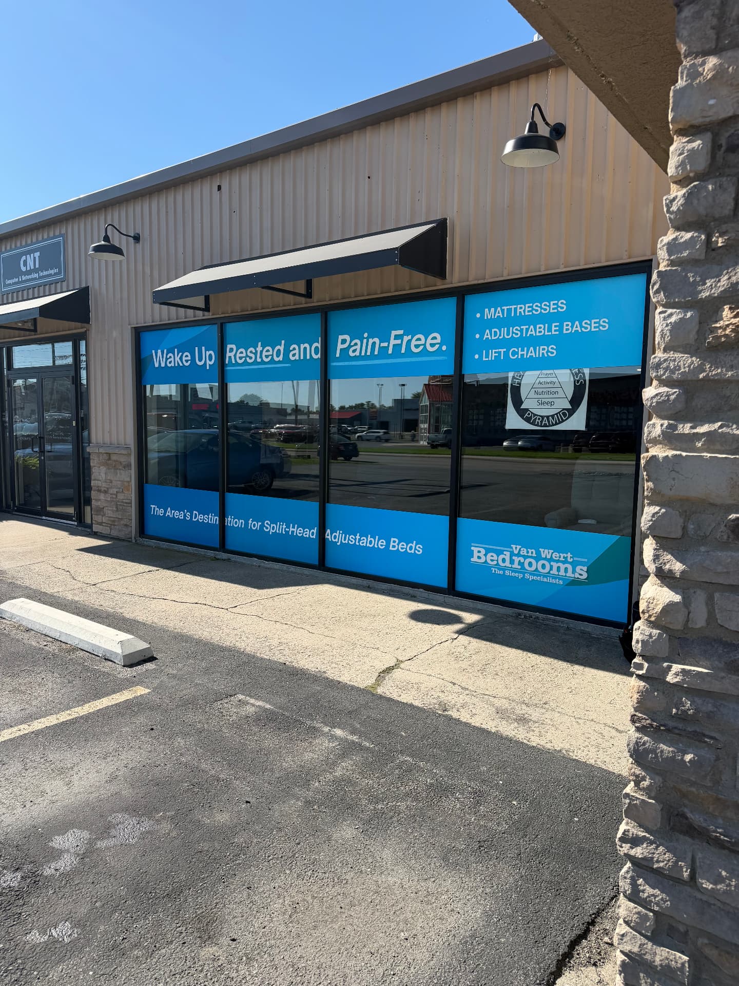 Full-color storefront window graphics for Van Wert Bedrooms