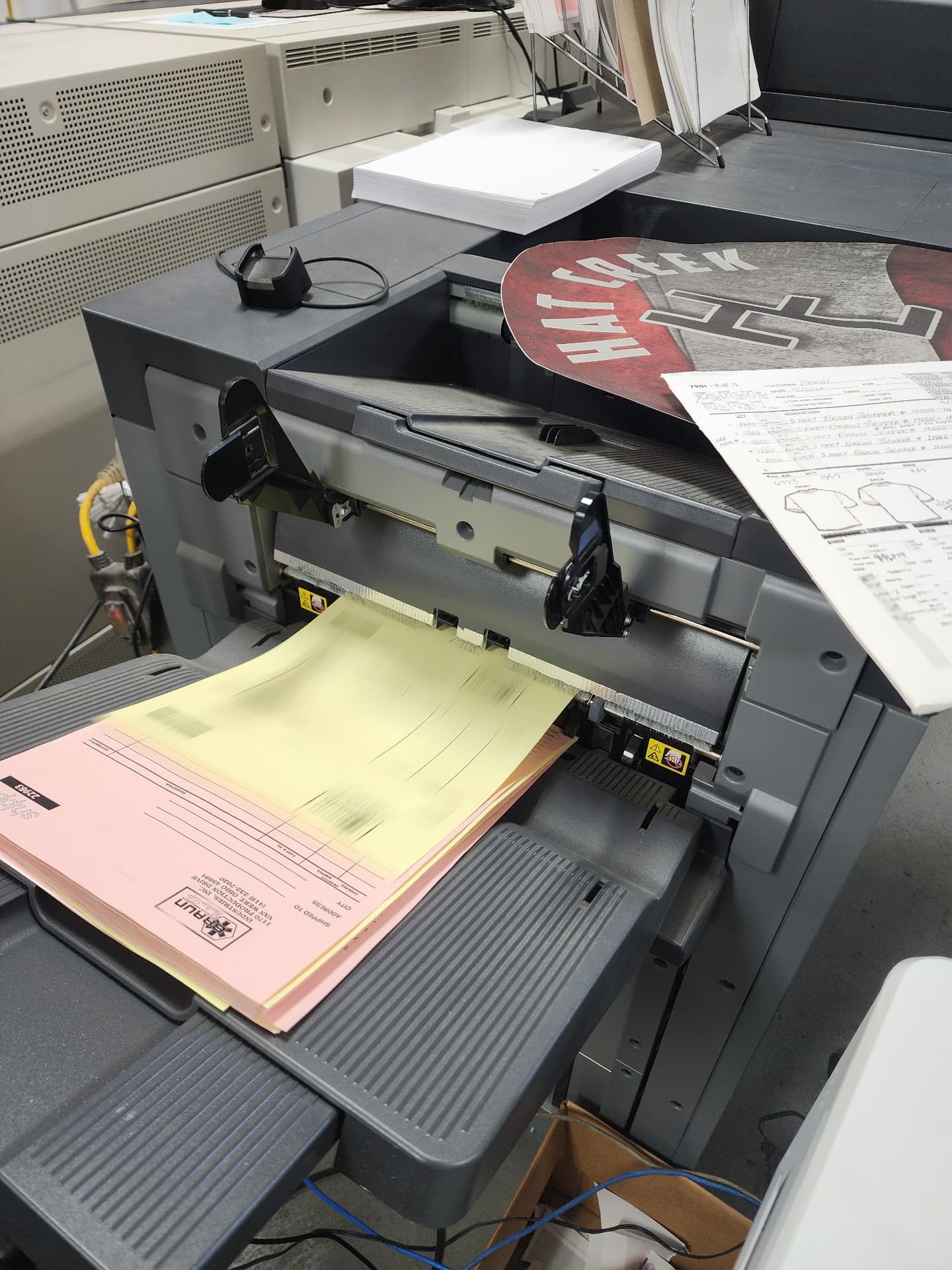 Two-part carbonless business forms coming off the press