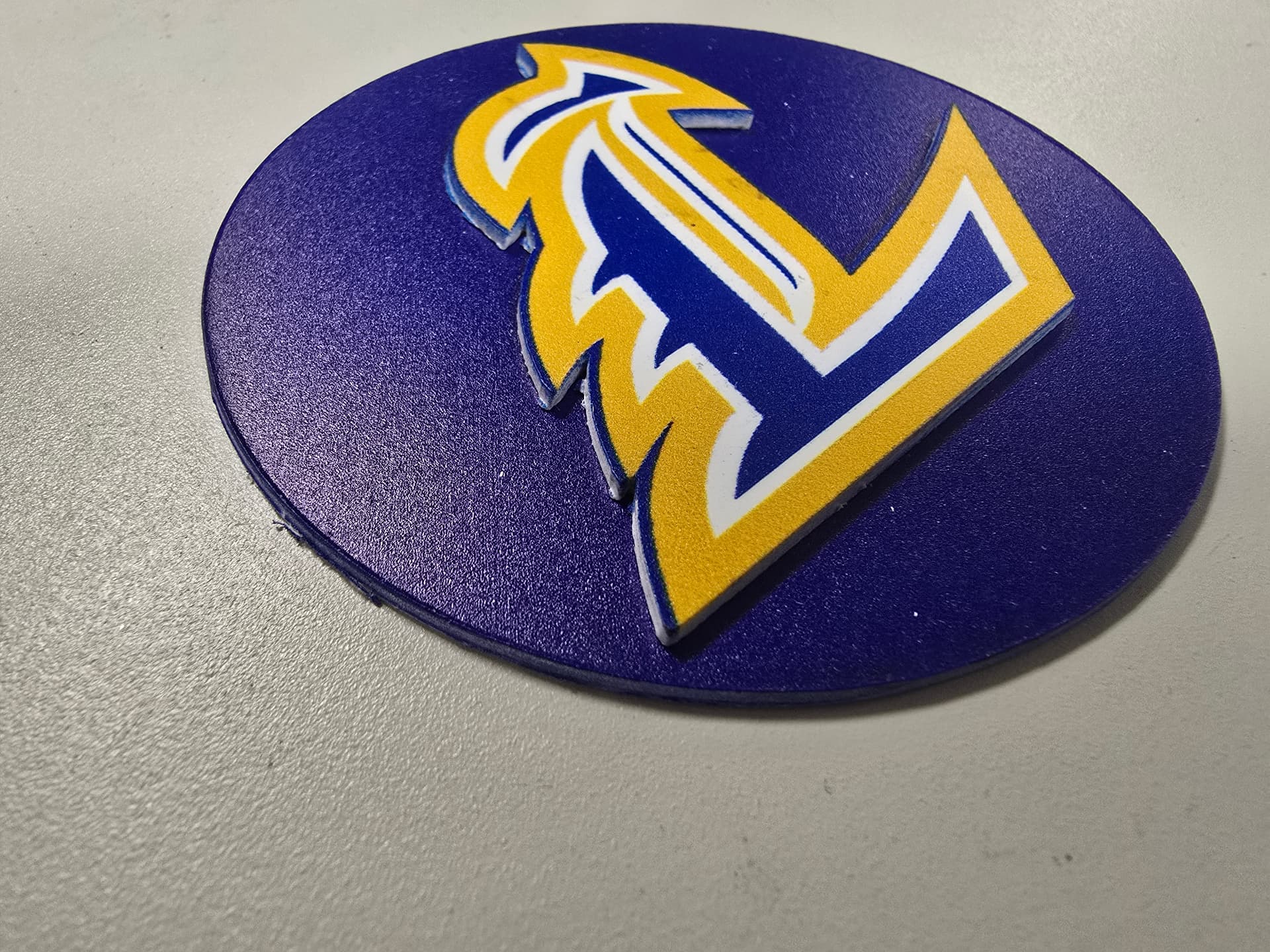 Layered laser-cut acrylic logo emblem